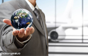 business man holds globe in the airport"Elements of this image f